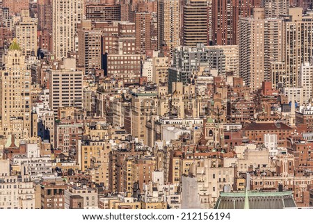 Aerial view of the super crowded, populated, and busy New York city in the USA showcasing the sea of historic and ancient buildings that characterize its world wide known architecture.