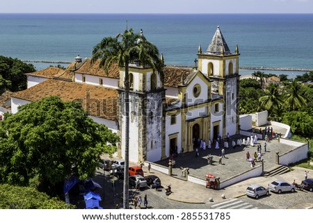 OLINDA, BRAZIL - MAY 1: Aerial view of Olinda in PE, Brazil showcasing its historic architecture with the Baroque Se Church after a service with priests and locals passing by on May 1, 2015 in Olinda.