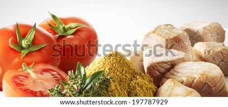 Tomato, aromatic plant, cumin, pieces of raw veal meat on a white background
