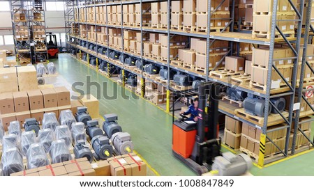 mobile forklift truck in the warehouse of an industrial company - storage of produced goods for dispatch to the customer