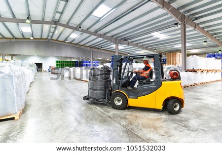 forklift trucks transported in a warehouse - storage of goods in a forwarding agency