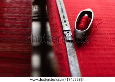 vintage old retro loom with red strings
