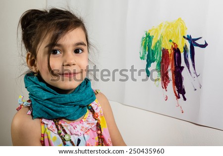 young little girl portrait painting on wall