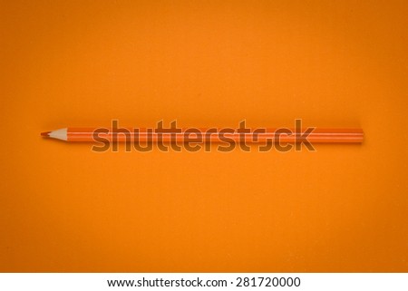 orange color drawing pencil on orange paper