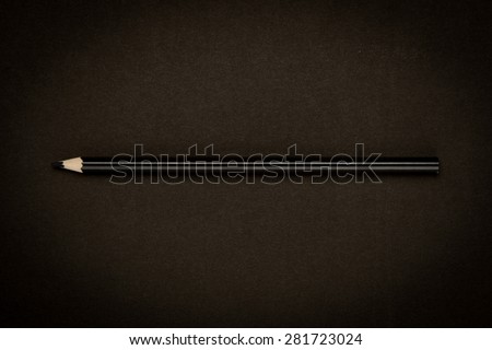 black color drawing pencil on black paper