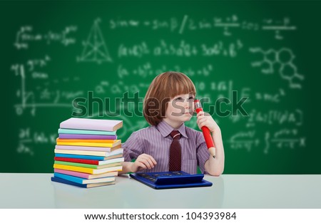 Boy genius thinking - young child in school learning various subjects