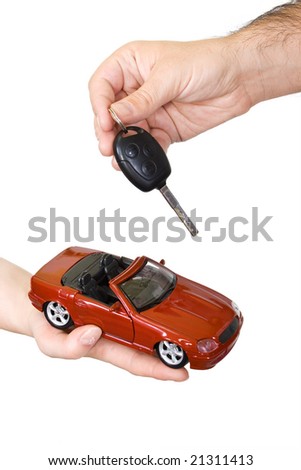 stock photo Woman and man hands with red sports car and key isolated