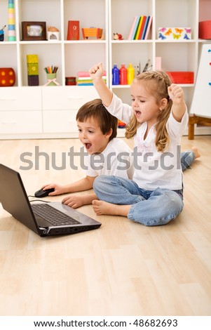 Stressed or excited kids about to win computer game