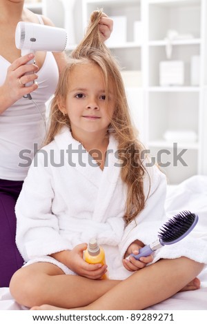 Drying hair after bath - little girl personal hygiene activities