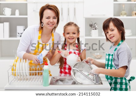 Kids helping their mother in the kitchen - washing the dishes