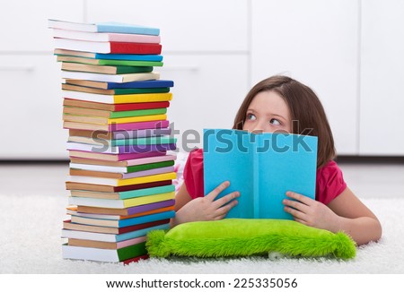 Young student worried by the volume of knowledge she has to learn