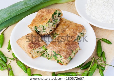 Indonesian Food Martabak Asin and birds eye chili in white plate