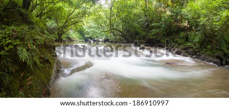 River water stream in Citumang Indonesia with green trees Panorama