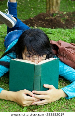 Female College student reading education books outdoor