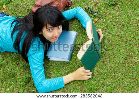 Female College student reading education books outdoor