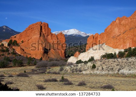 Garden of the Gods in Colorado Springs - red sandstone formations with Pikes Peak in background.