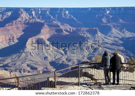 Grand Canyon National Park, Arizona - tourists at scenic overlook, morning on the south rim.
