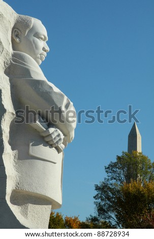 WASHINGTON, D.C. - OCTOBER 29, 2011 - Granite statue of Dr. King at the Martin Luther King Memorial on the National Mall with Washington Monument in background, October 28, 2011 in Washington, D.C.