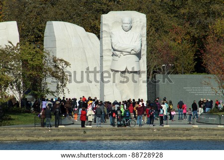 WASHINGTON, D.C. - OCTOBER 28, 2011: Crowd gathers around the statue of Dr. King at the Martin Luther King Memorial on Tidal Basin at the National Mall, October 28, 2011 in Washington, D.C.