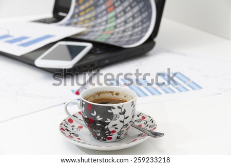 Photo of the Businessman  with coffee and laptop analyzing of the  monitoring profit dynamics in the company