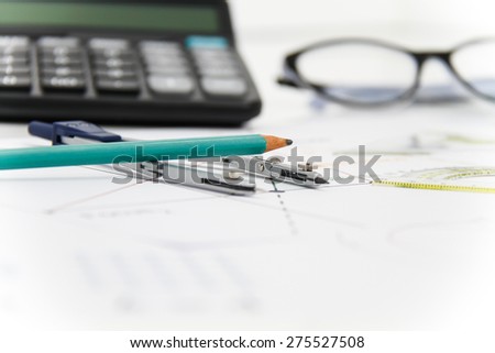 Business and Architectural project, pair of compasses, glasses, rulers and calculator - business concept