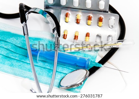Photo of the Set for flu treatment, thermometer, nasal sprays, protective surgical mask, stethoscope, syringe...