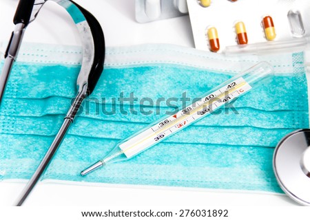 Photo of the Set for flu treatment, thermometer, nasal sprays, protective surgical mask, stethoscope, syringe...