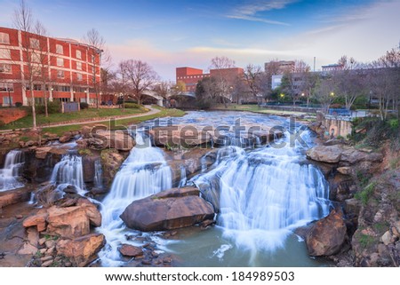 Reedy River Waterfalls run through the middle of downtown Greenville, South Carolina at Falls Park River Walk.