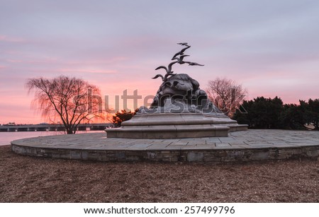 WASHINGTON, DC - FEBRUARY 14, 2015:  The Navy-Merchant Marine Memorial is located in Lady Bird Johnson Park, Columbia Island, in Washington DC and is also known as the waves and seagulls monument.