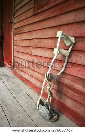 Orthopedic equipment for the correction. Against red wooden wall.