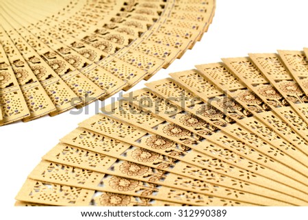 Close-up wood fan with white background.Abstract background.