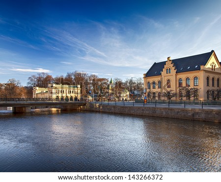 Image of a bridge and old buildings by the river in the center of Uppsala, Sweden.