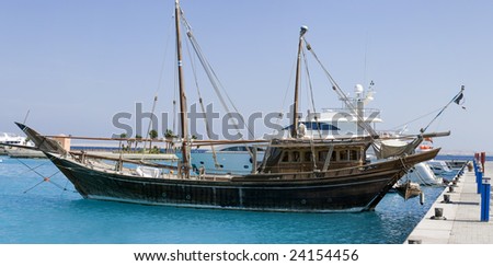 rustic antique looking yacht in the red sea harbour of Sekalla, Hurghada