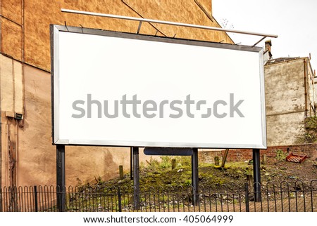 Image of blank advertising billboard in an urban setting.