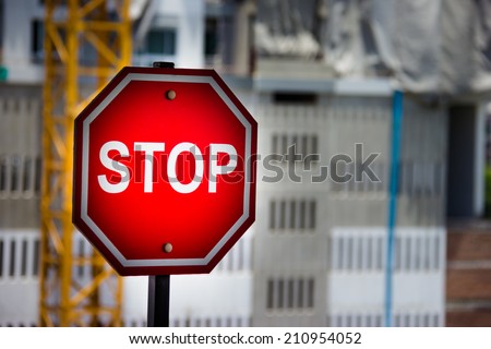Stop sign Construction site background.