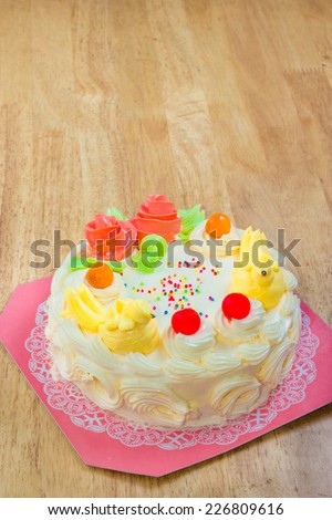 Cream cake with Jelly on the wooden table