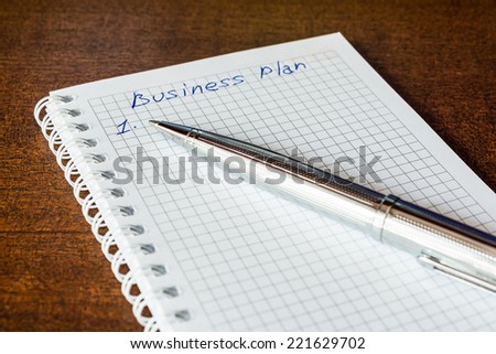 Business plan sign in the notebook