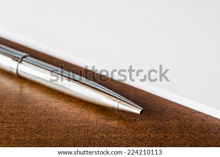 Paper and pen on the table