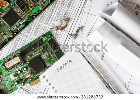 Plan for the repair of the computer, a notebook with a pen
