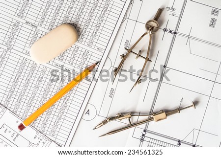 Diagrams and drawing tools on the table with a pencil and an eraser