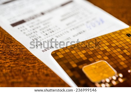Credit card and check from shopping on the table