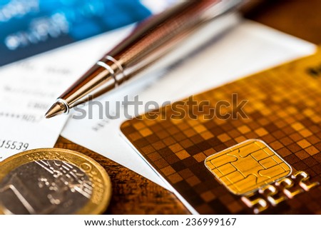 Pay the bills, credit cards with pen and money on the table