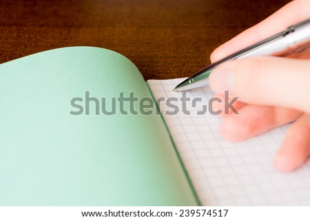 Pen and an exercise book, record in a notebook by pen