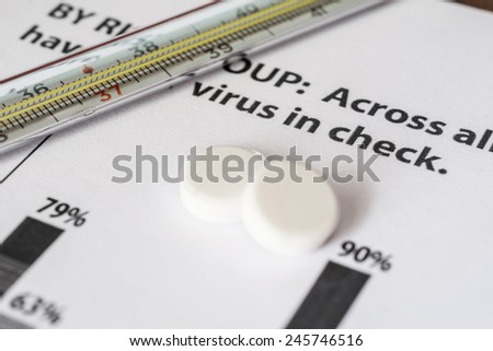 Statistics diseases, measure temperature by thermometer and take the pills. Angle view