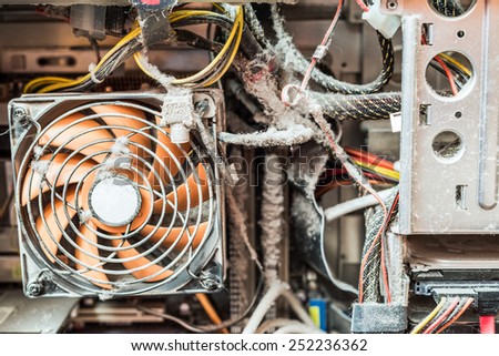 The main components of the outdated, dusty and non-working computer, clogged CPU fan