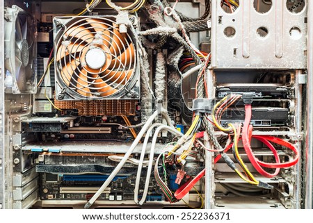 The main components of the outdated, dusty and non-working computer