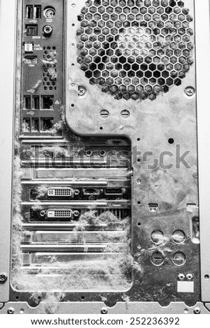 Dusty old computer, rear panel connectors. In black and white tones