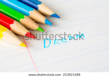 Word dream written in a notebook with colored pencils