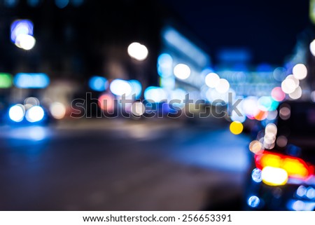 Nights lights of the big city, cars at night on the avenue. In blue tones