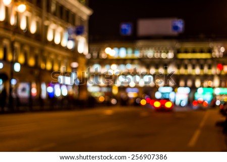 Night city, night life on the streets, the buildings in lights in the background